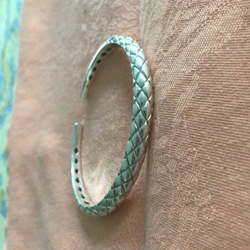 New with pouch. Michael Dawkins hinged sterling cuff, pouch